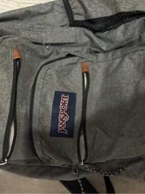 Jansport Gray Backpack with Navy Logo and Brown Tab Accents